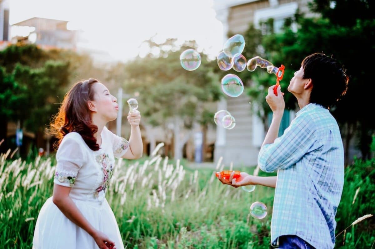 couple blowing bubbles