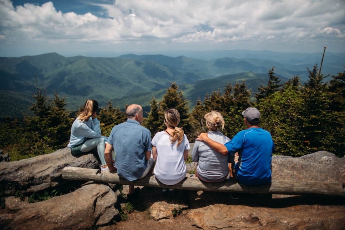 Family looking into the distance in the mountains